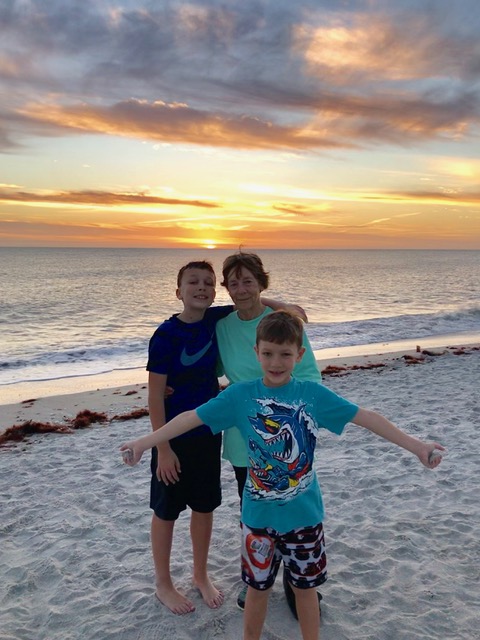 Kathy Berry and two grandsons enjoy a sunset on the Florida Beach.